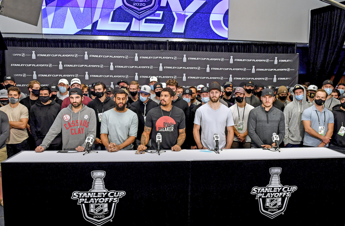 Nazem Kadri (left, in Cassius Clay sweatshirt) was the only HDA member left in the playoffs when the Jacob Blake shooting happened; he spoke alongside other players after play stopped following Blake’s shooting.